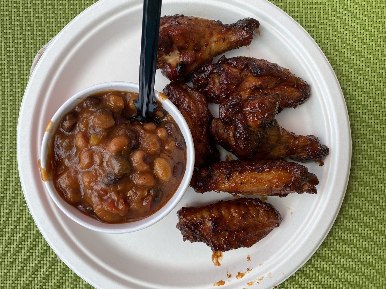 Smoked chicken wings and cowboy beans are delicious.