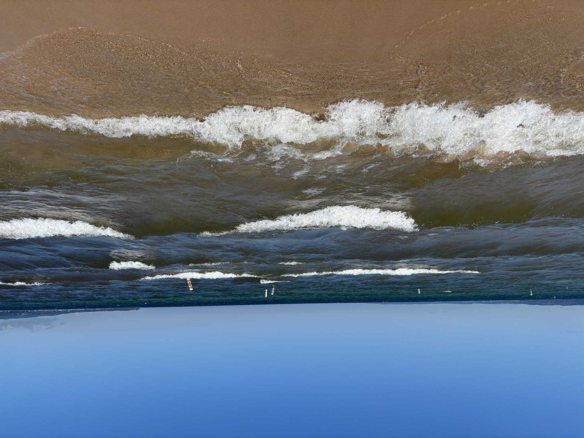 Look at
      those white caps on those choppy waves; the water is rough today.